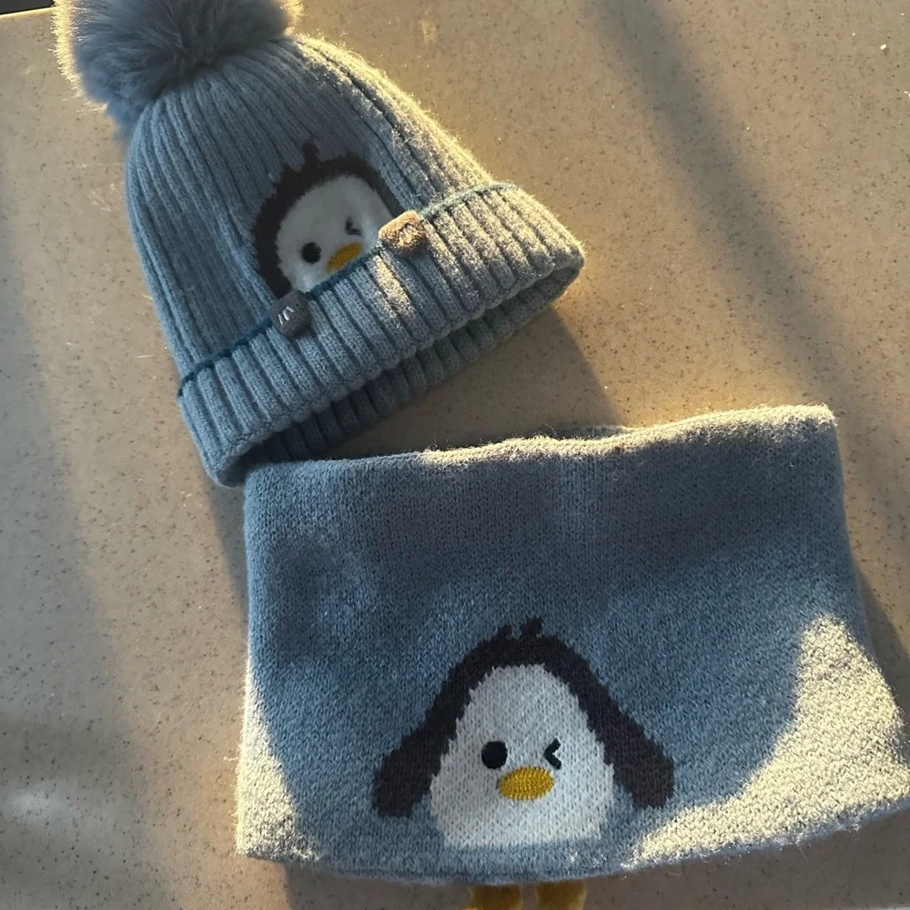 blue knitted children's winter penguin hat and scarf set